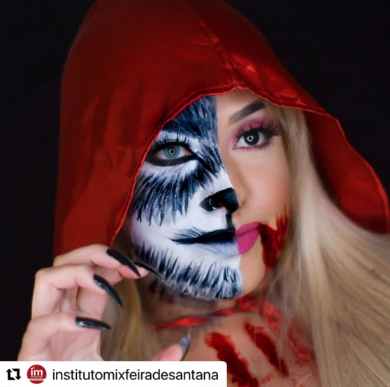 mulher maquiada de lobo mau e chapeuzinho